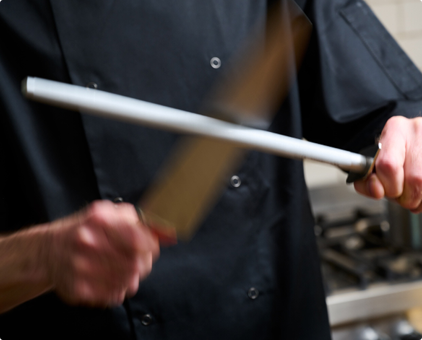 Action shot of sharpener being used on a knife